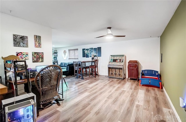 office featuring ceiling fan and light hardwood / wood-style flooring