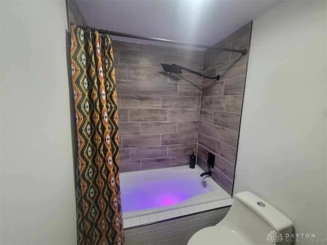 bathroom with shower / tub combo with curtain