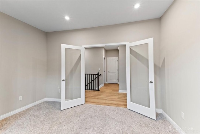 4517 Renaissance Blvd Unit 263, Franklin, OH 45005 - empty room with french doors, carpet floors, baseboards, and recessed lighting