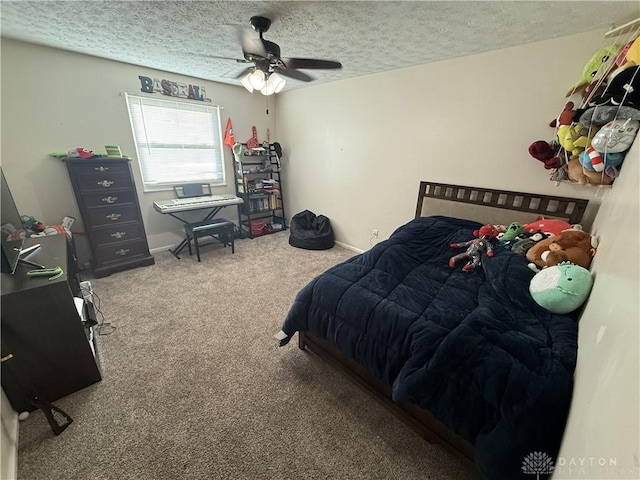 bedroom with carpet flooring, ceiling fan, and a textured ceiling