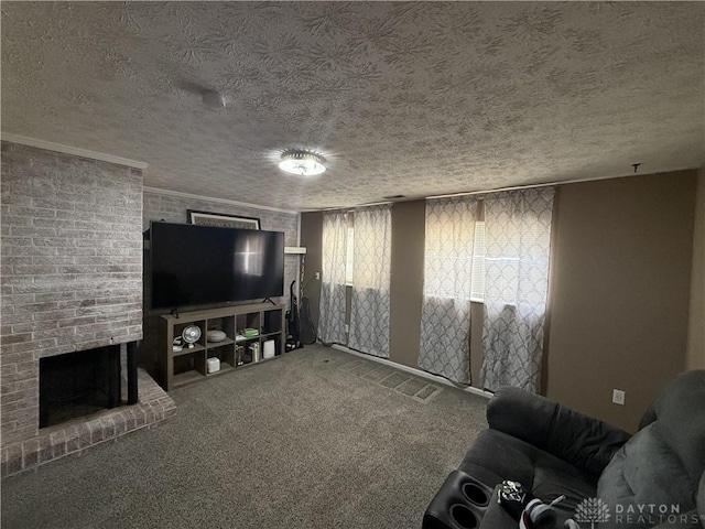 carpeted living room with crown molding, a fireplace, and a textured ceiling