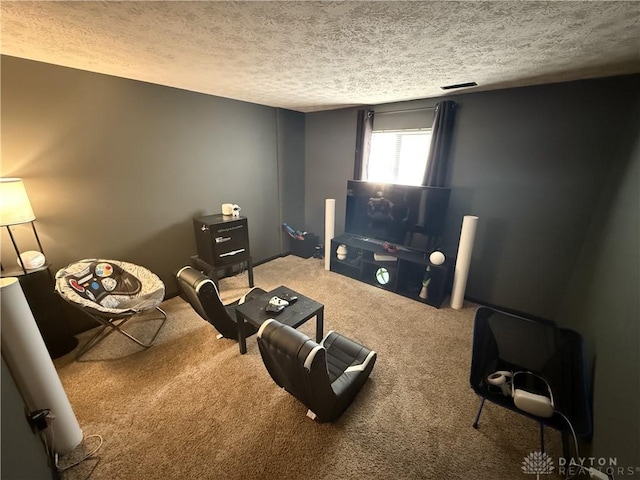 carpeted living room featuring a textured ceiling