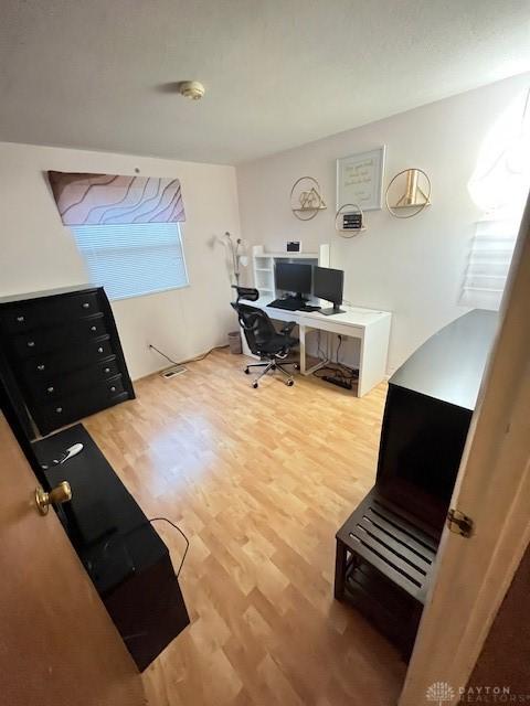 office area with hardwood / wood-style flooring