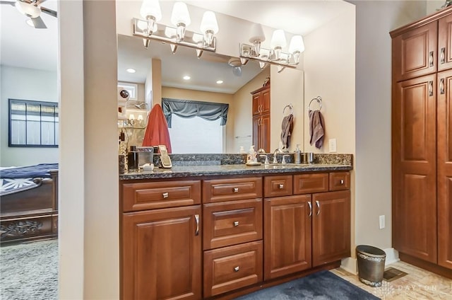 bathroom featuring vanity and ceiling fan