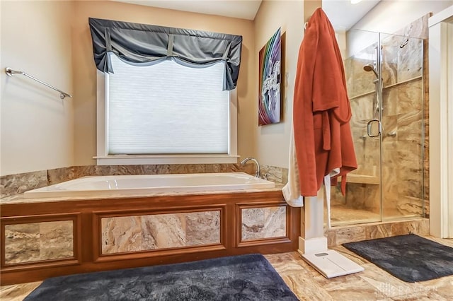 bathroom with shower with separate bathtub