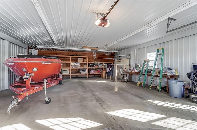 garage with a workshop area and a garage door opener