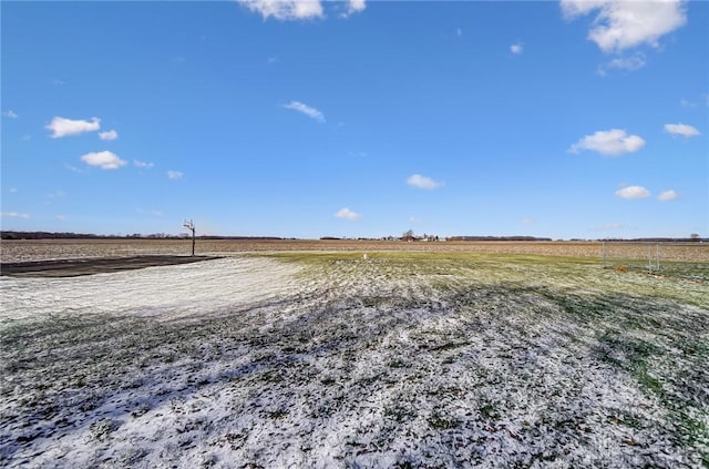 view of yard with a rural view