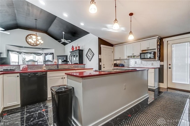 kitchen featuring ceiling fan with notable chandelier, black appliances, white cabinetry, hanging light fixtures, and lofted ceiling