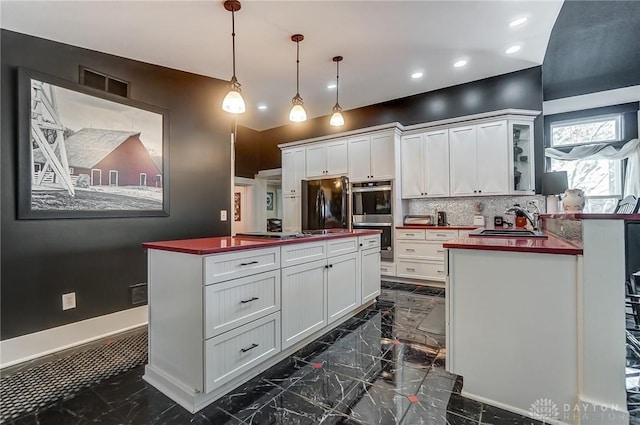 kitchen with double oven, black fridge, butcher block countertops, and white cabinets