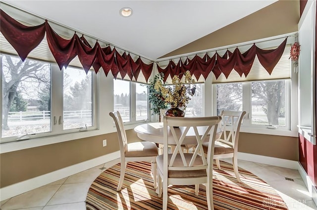 sunroom featuring a wealth of natural light and vaulted ceiling