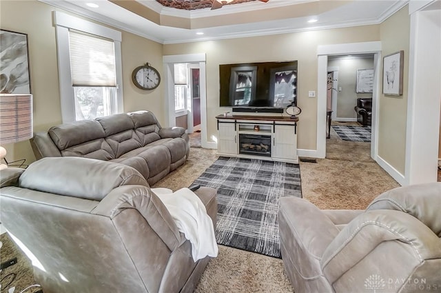 living room with light colored carpet and ornamental molding