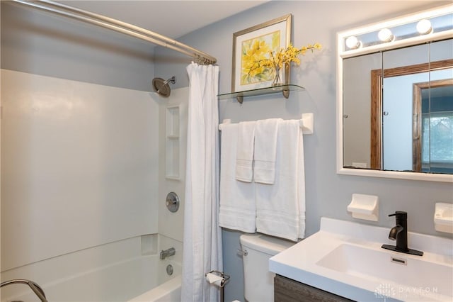 full bathroom featuring vanity, shower / bath combination with curtain, and toilet