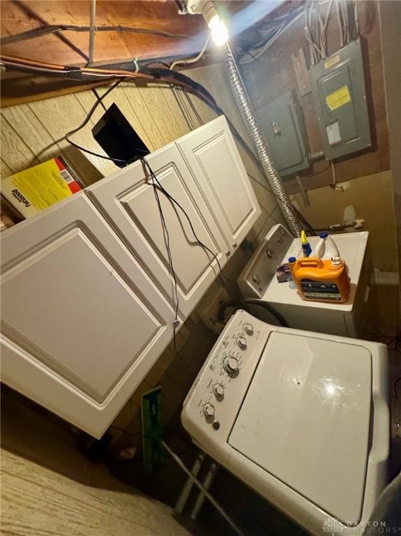 laundry room with separate washer and dryer and electric panel