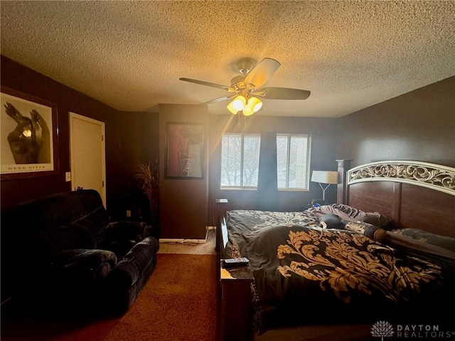 carpeted bedroom with ceiling fan and a textured ceiling