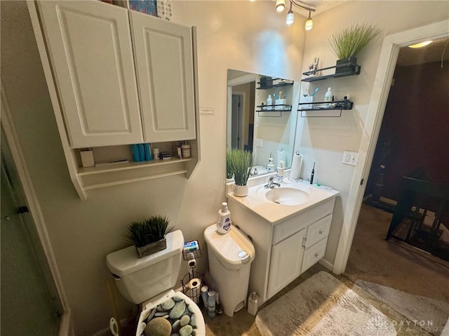 bathroom featuring vanity and toilet