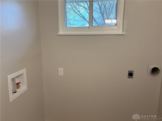 washroom with hookup for an electric dryer and washer hookup