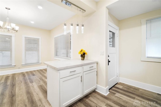 interior space with hardwood / wood-style flooring and a notable chandelier