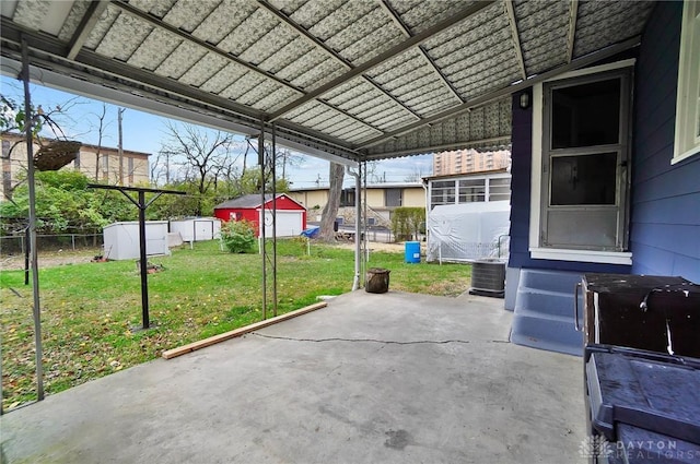 view of patio featuring an outbuilding and cooling unit