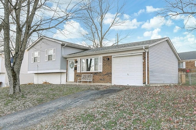 split level home featuring a garage