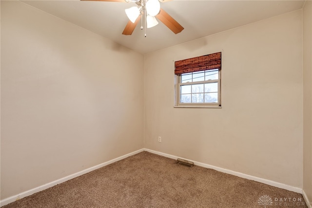 unfurnished room featuring ceiling fan and carpet floors