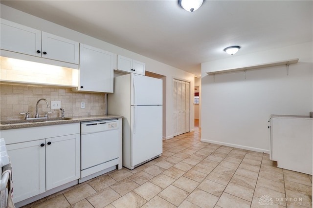 kitchen featuring sink, white appliances, decorative backsplash, and white cabinets