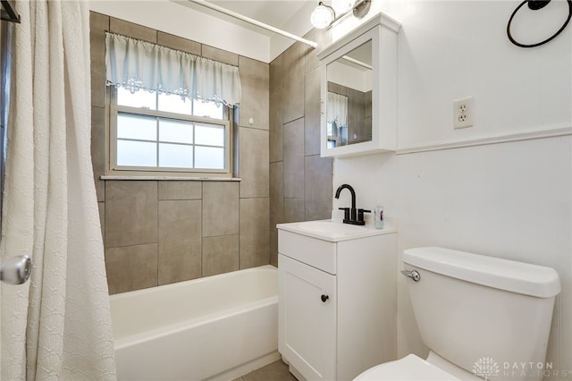 full bathroom featuring vanity, shower / bath combo, and toilet