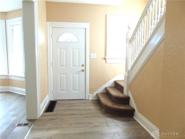 foyer entrance with wood-type flooring