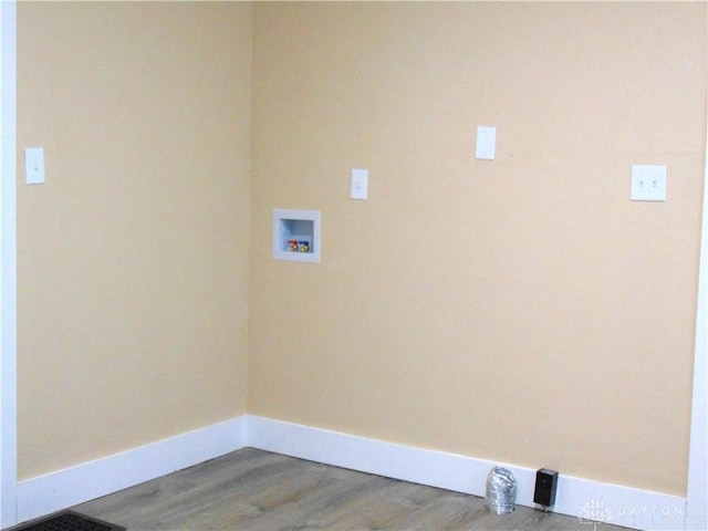 washroom featuring hookup for a washing machine and light hardwood / wood-style floors