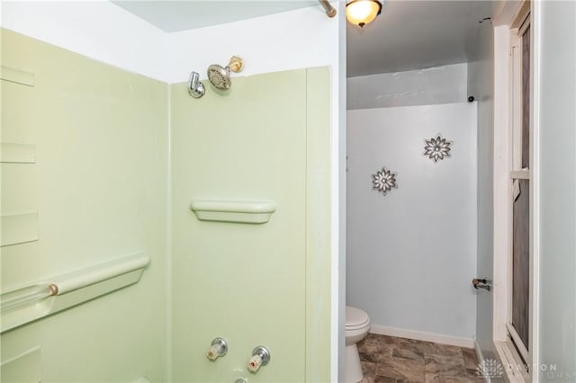 bathroom featuring toilet and a shower