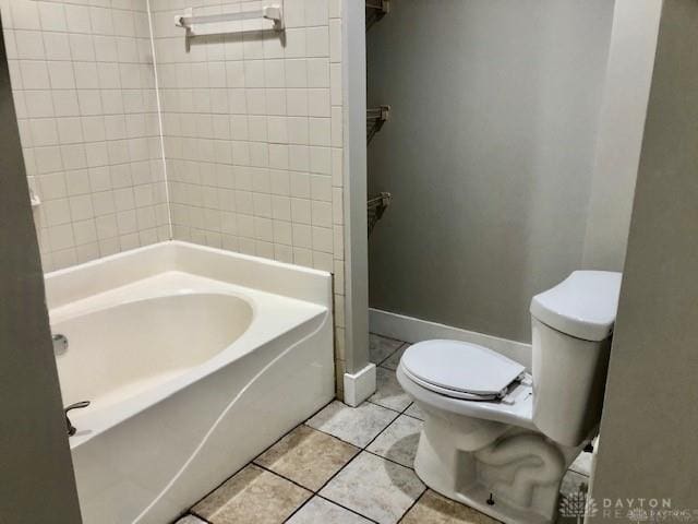 bathroom with tile patterned floors and toilet