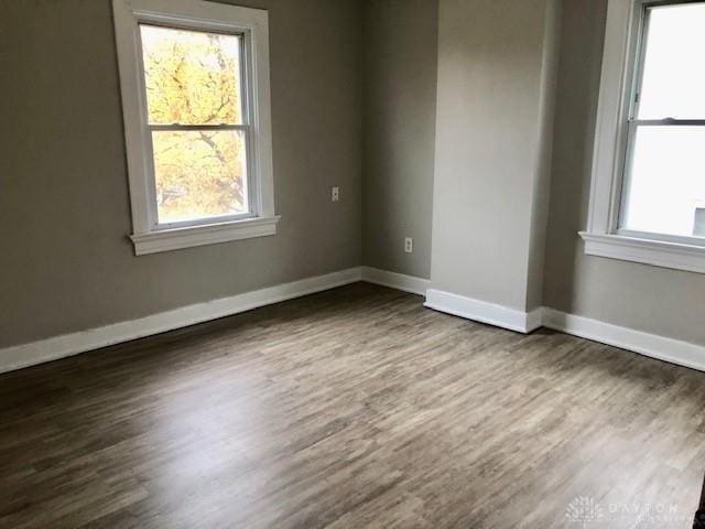 spare room featuring dark hardwood / wood-style floors