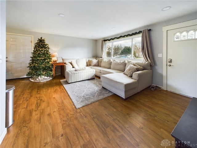 unfurnished living room featuring hardwood / wood-style flooring