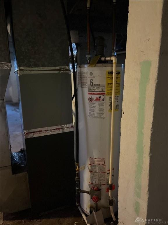 utility room with gas water heater