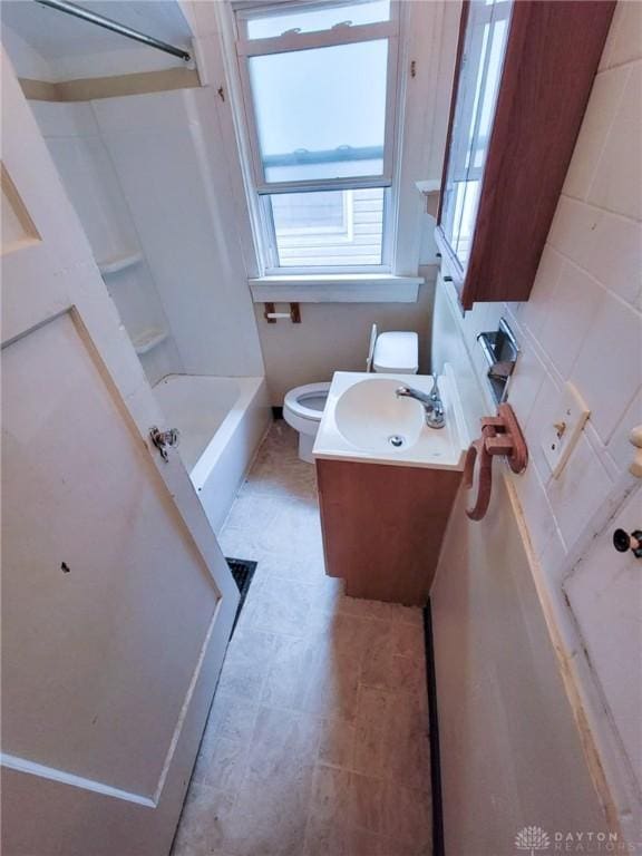 full bathroom with vanity, shower / washtub combination, and toilet