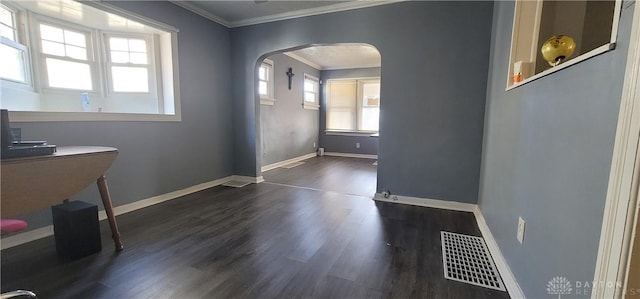 foyer entrance featuring crown molding and dark hardwood / wood-style flooring