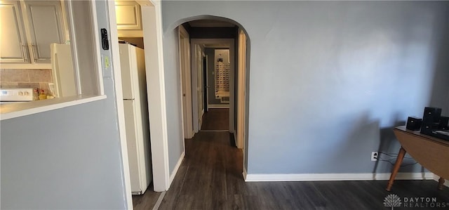 corridor with dark wood-type flooring