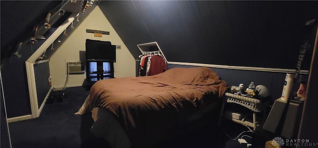 carpeted bedroom featuring a wall unit AC