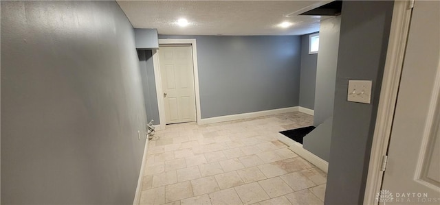 interior space with a textured ceiling