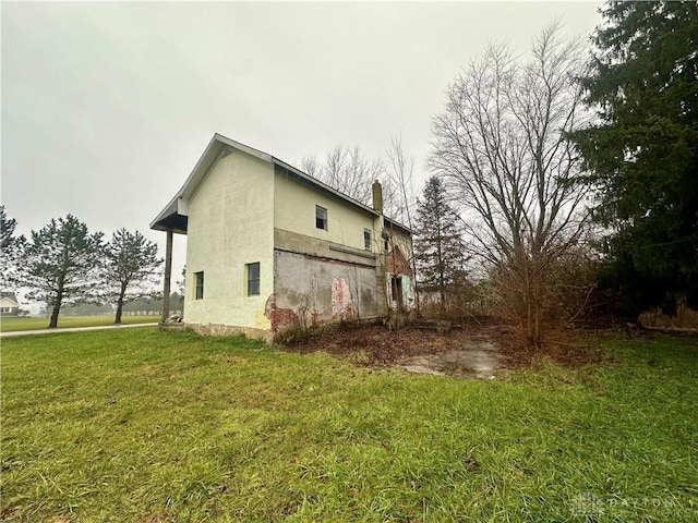 view of home's exterior featuring a yard