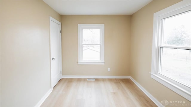 spare room with light hardwood / wood-style floors