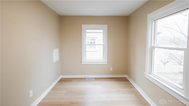 unfurnished room with light hardwood / wood-style flooring