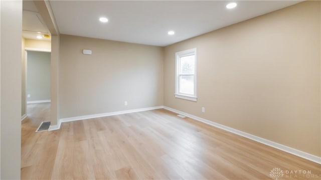 unfurnished room featuring light hardwood / wood-style floors