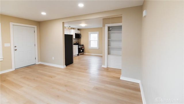 unfurnished living room featuring light hardwood / wood-style floors