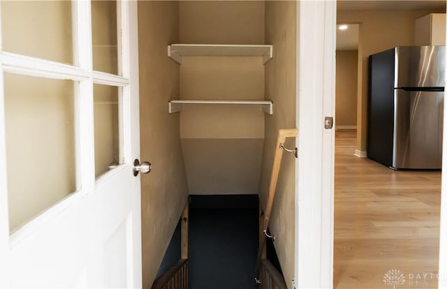 walk in closet featuring light hardwood / wood-style floors