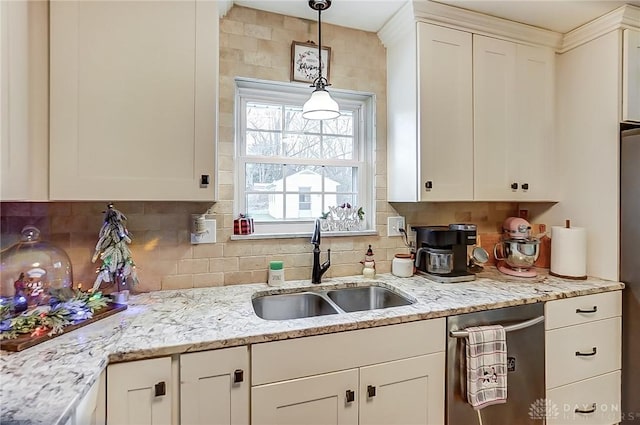 kitchen with decorative backsplash, sink, and stainless steel dishwasher