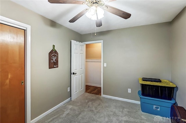 unfurnished bedroom with ceiling fan, a closet, and light carpet