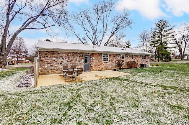 back of house featuring a patio area, a yard, and central AC