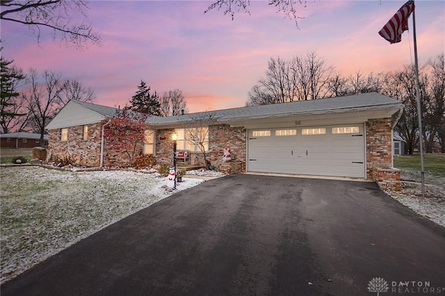 ranch-style home with a garage