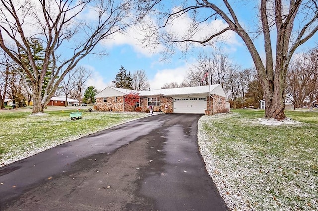 single story home featuring a front yard and a garage