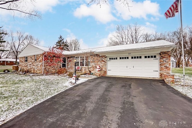 single story home featuring a garage